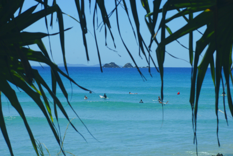 Surfing At Wategos Bay with Julian Rocks in the Background